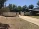 Spacious single story home, driveway, gate and back garage in a suburban neighborhood at 1447 E Town And Country Ln, Phoenix, AZ 85014