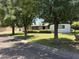 Quaint single story home with a well maintained lawn and established shade trees at 1447 E Town And Country Ln, Phoenix, AZ 85014
