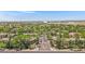 Expansive aerial view of the community showcasing lush greenery and well-maintained streets on a clear, sunny day at 15050 N Thompson Peak Pkwy # 1001, Scottsdale, AZ 85260