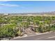 Beautiful aerial shot of the neighborhood entrance, lined with palm trees and lush landscaping at 15050 N Thompson Peak Pkwy # 1001, Scottsdale, AZ 85260