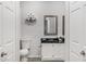 Cozy bathroom with framed mirror and dark countertop and gray tile floors at 15050 N Thompson Peak Pkwy # 1001, Scottsdale, AZ 85260