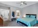 Carpeted bedroom with view of closet, bathroom and hallway at 15050 N Thompson Peak Pkwy # 1001, Scottsdale, AZ 85260