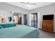 Bedroom features mirrored closet doors and private patio at 15050 N Thompson Peak Pkwy # 1001, Scottsdale, AZ 85260