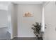 Bright entryway with a painting, ceramic tile floor, and a white front door at 15050 N Thompson Peak Pkwy # 1001, Scottsdale, AZ 85260