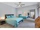Bright bedroom with ceiling fan, carpet and view of mirror closet doors at 15050 N Thompson Peak Pkwy # 1001, Scottsdale, AZ 85260