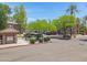 View of the parking area and meticulously maintained landscaping surrounding the community at 15050 N Thompson Peak Pkwy # 1001, Scottsdale, AZ 85260