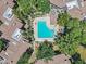 Aerial view of the community pool and spa area, surrounded by lounge chairs and lush landscaping at 15050 N Thompson Peak Pkwy # 1001, Scottsdale, AZ 85260