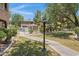 Paved walkway leading to community pool with trees and manicured landscaping at 15050 N Thompson Peak Pkwy # 1001, Scottsdale, AZ 85260