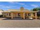 Charming backyard patio with tiled roof and desert landscaping at 16002 E Gleneagle Dr, Fountain Hills, AZ 85268