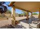 Outdoor covered patio with tile, featuring landscaped yard and rock ground cover at 16002 E Gleneagle Dr, Fountain Hills, AZ 85268