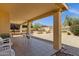 Backyard covered patio with tile flooring and outdoor seating, offering a serene outdoor retreat at 16002 E Gleneagle Dr, Fountain Hills, AZ 85268