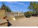 View of backyard landscaping with decorative planters and a wrought iron fence overlooking the desert at 16002 E Gleneagle Dr, Fountain Hills, AZ 85268