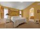 Cozy bedroom with carpet, complemented by ample natural light and en-suite bathroom access at 16002 E Gleneagle Dr, Fountain Hills, AZ 85268