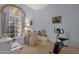 Bright bedroom featuring a large window and a cozy seating area at 16002 E Gleneagle Dr, Fountain Hills, AZ 85268