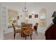Charming dining area with a round table, natural light, and arched windows at 16002 E Gleneagle Dr, Fountain Hills, AZ 85268