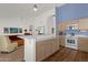 Open kitchen with island bar and views of living area at 16002 E Gleneagle Dr, Fountain Hills, AZ 85268