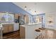 Bright kitchen with stainless steel appliances, breakfast bar, and eat-in area at 16002 E Gleneagle Dr, Fountain Hills, AZ 85268