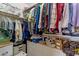 Organized walk-in closet featuring ample shelving and hanging space for storage at 16002 E Gleneagle Dr, Fountain Hills, AZ 85268