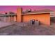 View of the backyard with a brick chimney, patio, and exterior wall, offering privacy and outdoor space at 17220 N 55Th Ave, Glendale, AZ 85308