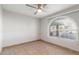 Bedroom with a ceiling fan and sunlit window at 17220 N 55Th Ave, Glendale, AZ 85308
