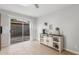 Bright dining area featuring sliding glass door to a private yard and custom storage console at 17220 N 55Th Ave, Glendale, AZ 85308