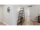 Stylish hallway featuring decorative shelving, neutral paint, and a view of the bathroom at 17220 N 55Th Ave, Glendale, AZ 85308