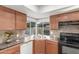 Well-lit kitchen featuring a corner window and modern appliances at 17220 N 55Th Ave, Glendale, AZ 85308