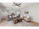 Cozy living room with comfortable seating, ceiling fan, and stylish decor at 17220 N 55Th Ave, Glendale, AZ 85308