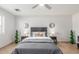 Comfortable main bedroom features stylish decor, ceiling fan, and bedside tables with lamps at 17220 N 55Th Ave, Glendale, AZ 85308