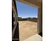 Wide backyard with block fence and clear blue skies at 17324 W Royal Palm Rd, Waddell, AZ 85355