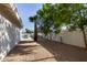Mature trees frame the backyard, offering shade and privacy by the pool at 1736 N Ashbrook Cir, Mesa, AZ 85213