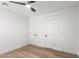 Bedroom features modern ceiling fan, wood floors, fresh paint and new door hardware for a contemporary look at 1736 N Ashbrook Cir, Mesa, AZ 85213