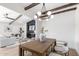 Open-concept dining area featuring a modern chandelier, spacious table, and stylish seating at 1736 N Ashbrook Cir, Mesa, AZ 85213