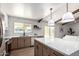 Spacious kitchen boasts a large island, modern appliances, and stylish cabinetry for a functional layout at 1736 N Ashbrook Cir, Mesa, AZ 85213