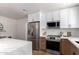 Stylish kitchen with stainless steel appliances, sleek countertops, and ample cabinet space at 1736 N Ashbrook Cir, Mesa, AZ 85213