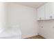 This laundry room has ample counter space and modern cabinets at 1736 N Ashbrook Cir, Mesa, AZ 85213