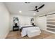 Serene main bedroom featuring a ceiling fan, a stylish rug, and bright natural light at 1736 N Ashbrook Cir, Mesa, AZ 85213