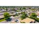 View of a home with a well manicured yard with mature trees in an established neighborhood at 1736 N Ashbrook Cir, Mesa, AZ 85213