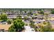 View of the house in a well established Phoenix neighborhood with mature trees at 1736 N Ashbrook Cir, Mesa, AZ 85213