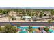 House in a desirable neighborhood with lush landscaping and mature trees at 1736 N Ashbrook Cir, Mesa, AZ 85213