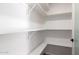 Bright white pantry featuring ample shelving, providing generous storage space at 1736 N Ashbrook Cir, Mesa, AZ 85213