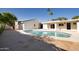 The sparkling swimming pool is the focal point of this private backyard oasis at 1736 N Ashbrook Cir, Mesa, AZ 85213