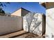 A small backyard storage shed beside a block wall to store your gardening tools at 1736 N Ashbrook Cir, Mesa, AZ 85213