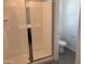 Bathroom showcasing a glass shower and toilet at 17989 W Lupine Ave, Goodyear, AZ 85338