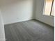 Bedroom featuring neutral carpet, base trim and natural lighting at 17989 W Lupine Ave, Goodyear, AZ 85338