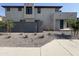 Stylish home showcasing desert landscaping, stucco facade, and a block wall at 17989 W Lupine Ave, Goodyear, AZ 85338