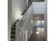Bright foyer featuring high ceilings and a stairway leading to the upper level at 17989 W Lupine Ave, Goodyear, AZ 85338