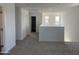 Bright loft area with neutral carpet, leading to bathroom and bedroom areas at 17989 W Lupine Ave, Goodyear, AZ 85338