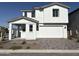 Beautiful two-story home showcasing modern white exterior and a welcoming covered front porch at 18061 W Lupine Ave, Goodyear, AZ 85338