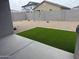 The outdoor patio with a small section of artificial turf at 18374 W Poston Dr, Surprise, AZ 85387